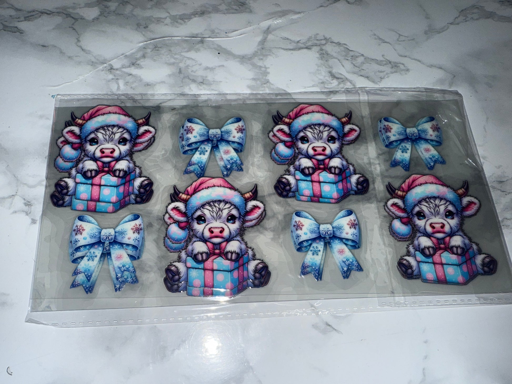 Decorative Blue UVDTF with cartoon cows and bows 